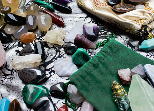 Rocks and jewelry bags on tabletop